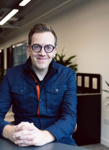 Jon Berry, sitting in an office